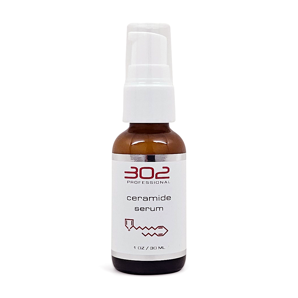 Brown glass spray bottle labeled 'ceramide serum' with white pump, 1 oz / 30 ml, standing upright against a white background