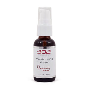 Brown glass spray bottle with white pump labeled 'moisturizing drops' (1 fl oz / 30 ml).