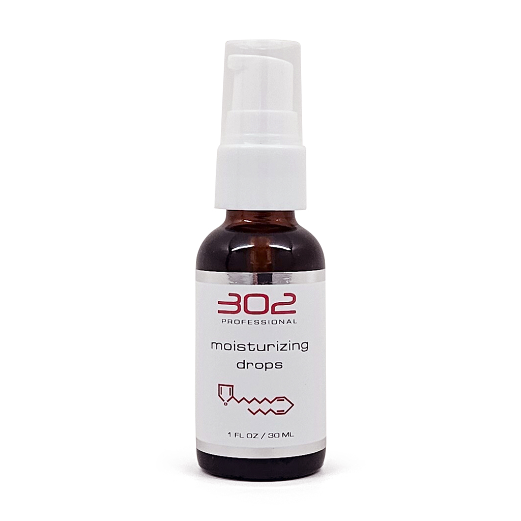 Brown glass spray bottle with white pump labeled 'moisturizing drops' (1 fl oz / 30 ml).