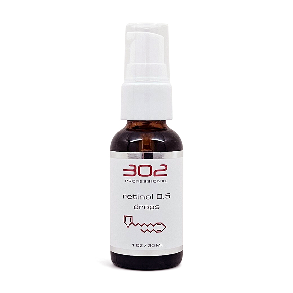 Brown glass spray bottle with white pump labeled '302 Professional' and 'retinol 0.5 drops' (1 oz / 30 ml).