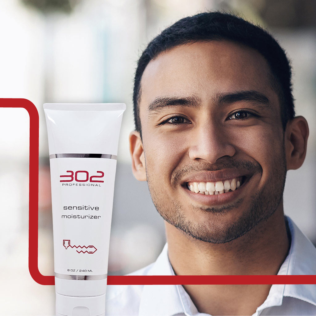 SENSITIVE-MOISTURIZER-8OZ_MAN_2_1024x1024_72 | 302 Professional Skincare Smiling man with a tube of 302 Professional Sensitive Moisturizer in the foreground.