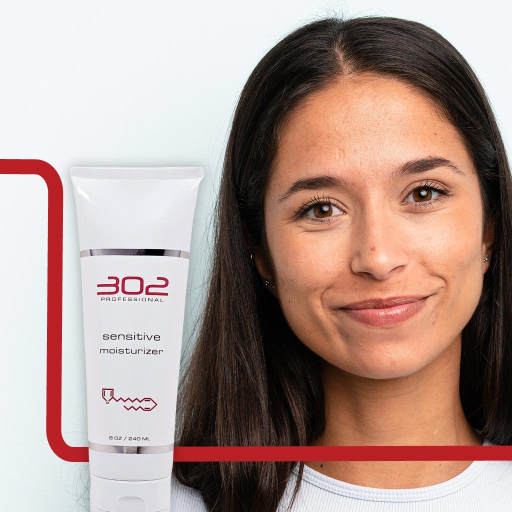 SENSITIVE-MOISTURIZER-8OZ_WOMAN_6_1024x1024_72 | 302 Professional Skincare Smiling woman beside a white tube labeled '302 Professional' sensitive moisturizer.